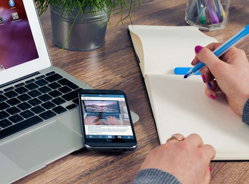 woman brainstorming a content strategy on a notebook
