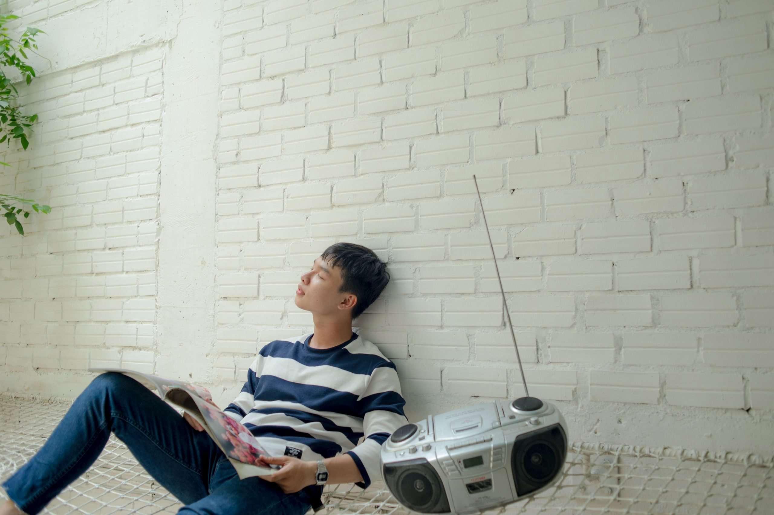 man listening to a radio